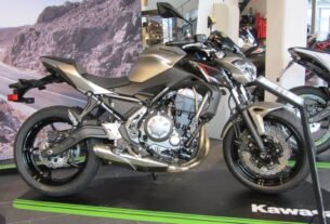 Side profile of a 2017 Kawasaki Z650 naked bike in metallic flat raw titanium and spark black